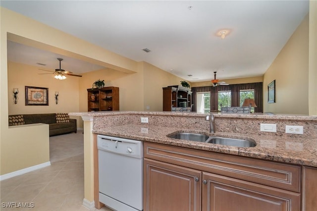 14531 Abaco Lakes Dr Unit 103, Fort Myers, FL 33908 - kitchen featuring dishwasher, a ceiling fan, open floor plan, light stone countertops, and light tile patterned flooring