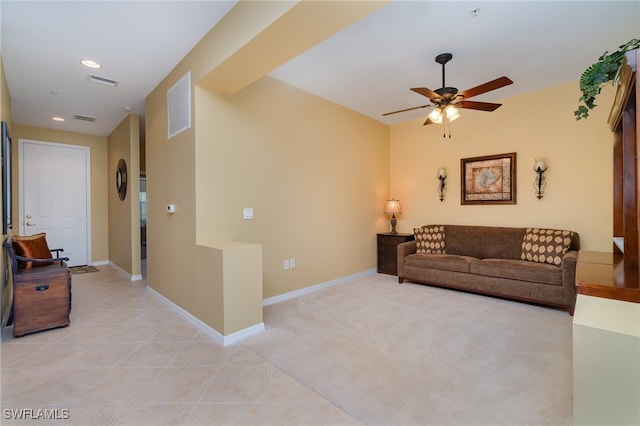 living room featuring light colored carpet and ceiling fan