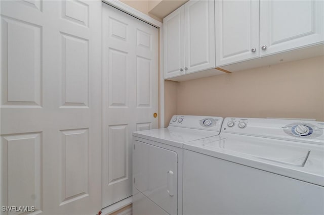 14531 Abaco Lakes Dr Unit 103, Fort Myers, FL 33908 - laundry room with washing machine and clothes dryer and cabinet space