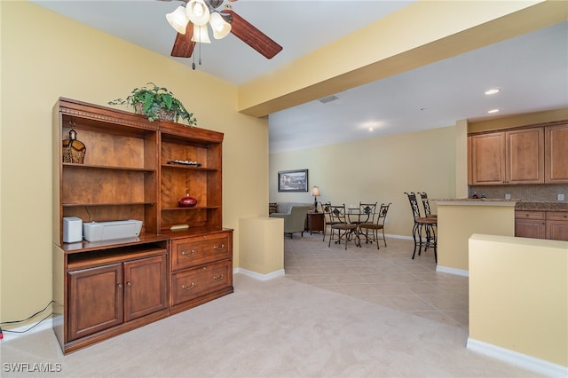 office area featuring ceiling fan and light colored carpet