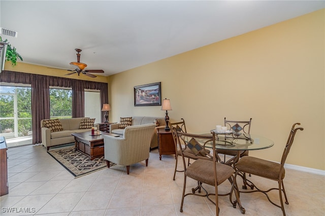 tiled living room featuring ceiling fan