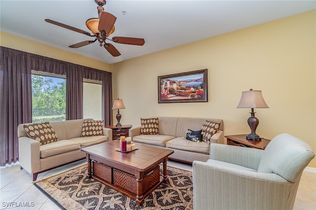 tiled living room with ceiling fan