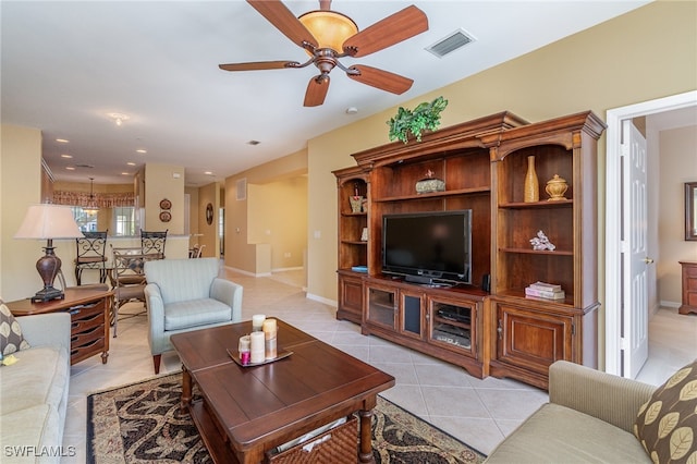 living room with ceiling fan and light tile patterned floors