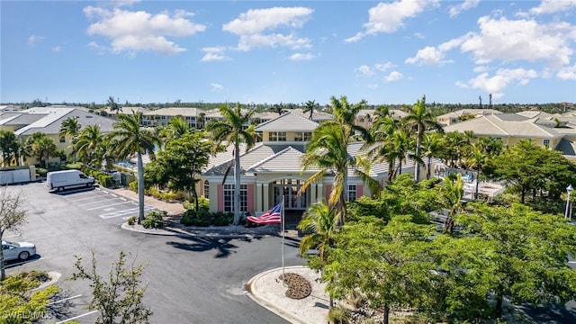 14531 Abaco Lakes Dr Unit 103, Fort Myers, FL 33908 - view of building exterior featuring a residential view and uncovered parking