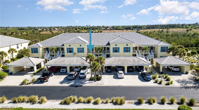 14531 Abaco Lakes Dr Unit 103, Fort Myers, FL 33908 - view of front facade featuring covered parking