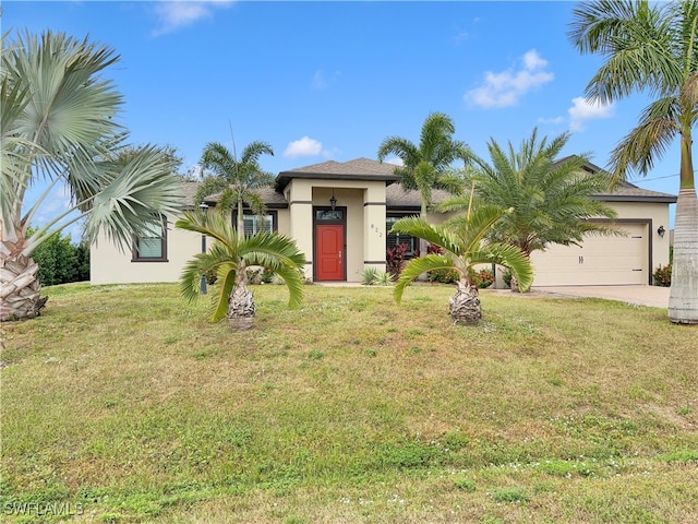 view of front of home featuring a garage and a front lawn