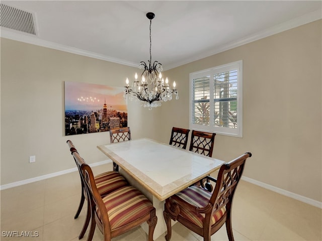 dining area featuring ornamental molding and an inviting chandelier