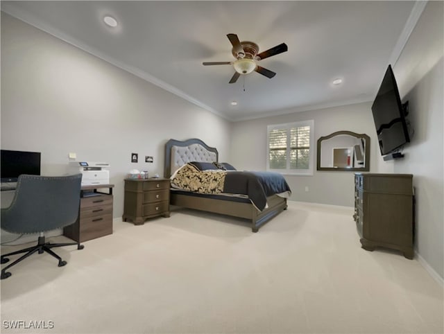 carpeted bedroom featuring ceiling fan and ornamental molding