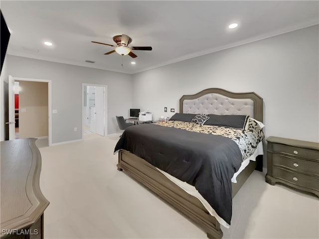 carpeted bedroom featuring ceiling fan, ornamental molding, and ensuite bath