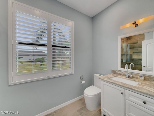 bathroom featuring tile patterned floors, a shower with door, vanity, and toilet