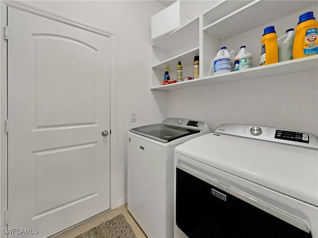 laundry room with washing machine and clothes dryer