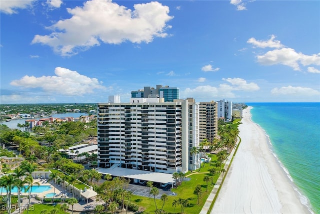 bird's eye view featuring a view of the beach and a water view