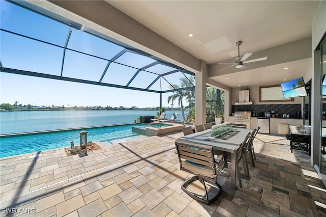 view of patio featuring a water view, ceiling fan, a pool with hot tub, a lanai, and area for grilling