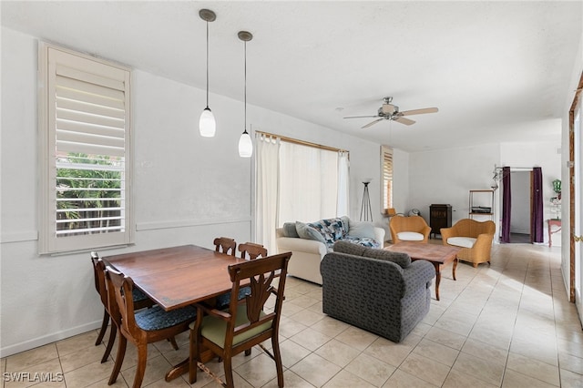 dining room featuring ceiling fan and light tile patterned floors