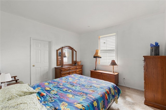 bedroom with light carpet