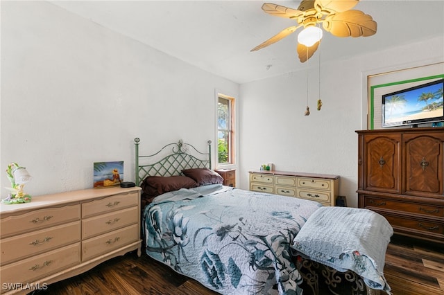 bedroom with ceiling fan and dark hardwood / wood-style flooring