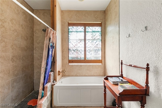 bathroom with separate shower and tub