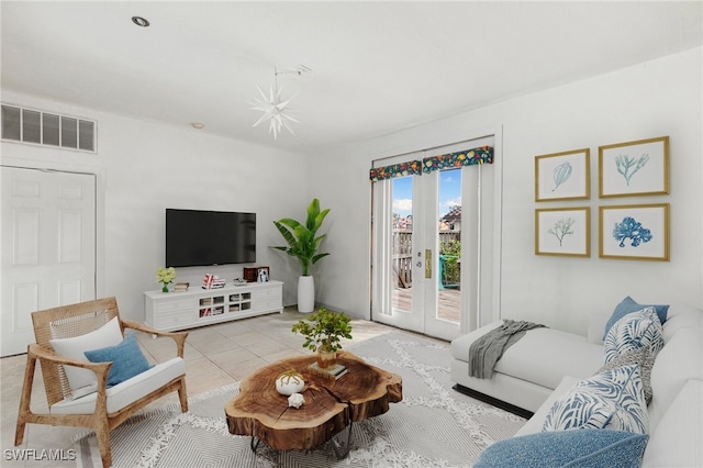 living room with light tile patterned floors and french doors