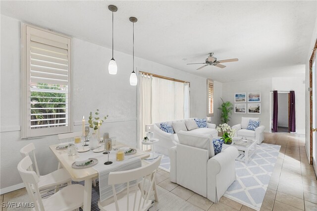 tiled living room with ceiling fan