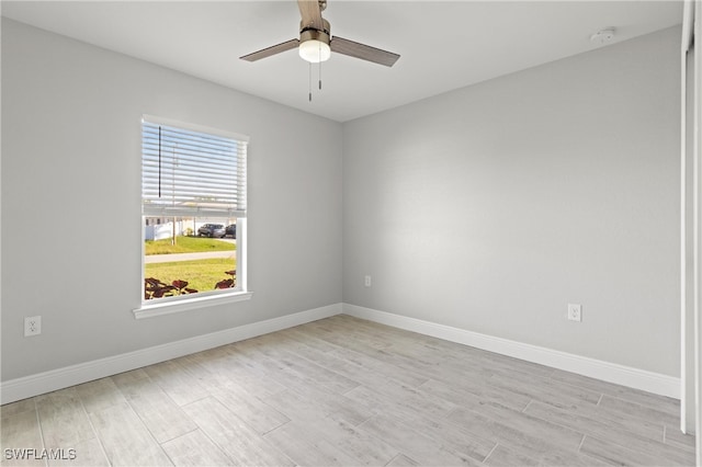 unfurnished room with ceiling fan and light hardwood / wood-style floors