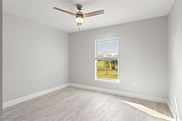 spare room with ceiling fan and light hardwood / wood-style flooring