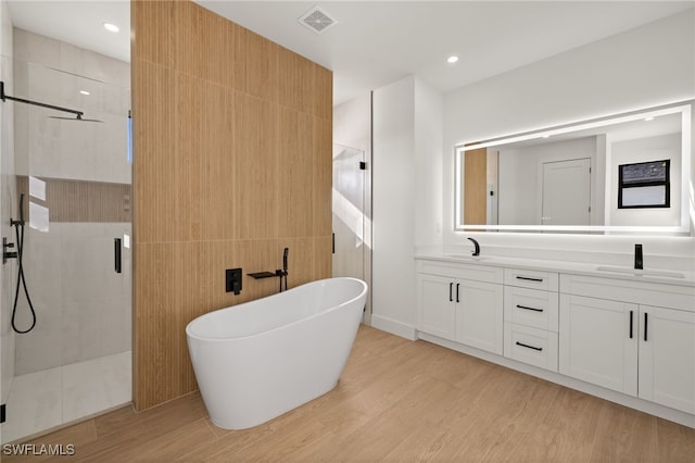 bathroom featuring a shower stall, visible vents, and a sink