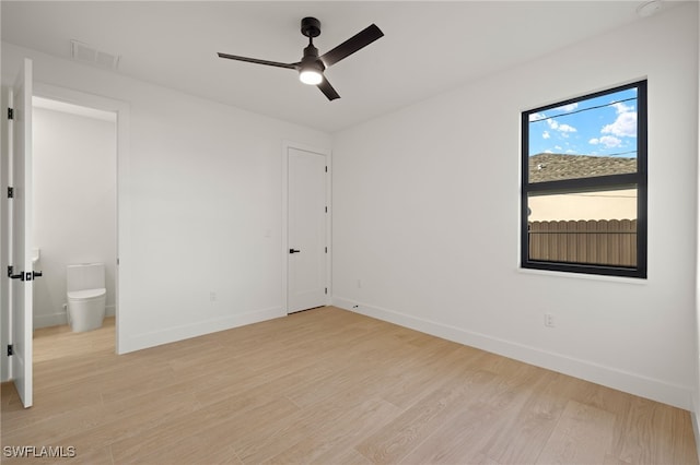 unfurnished bedroom with light wood-type flooring, baseboards, and visible vents