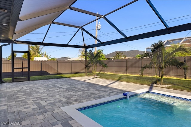 view of swimming pool featuring a patio, a fenced backyard, a lanai, and a fenced in pool