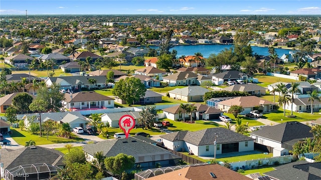 aerial view with a residential view and a water view