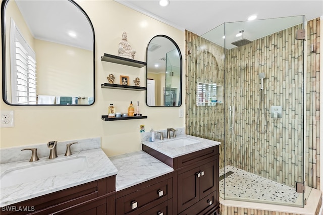 bathroom with vanity and a shower with shower door