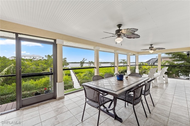 sunroom featuring plenty of natural light and ceiling fan