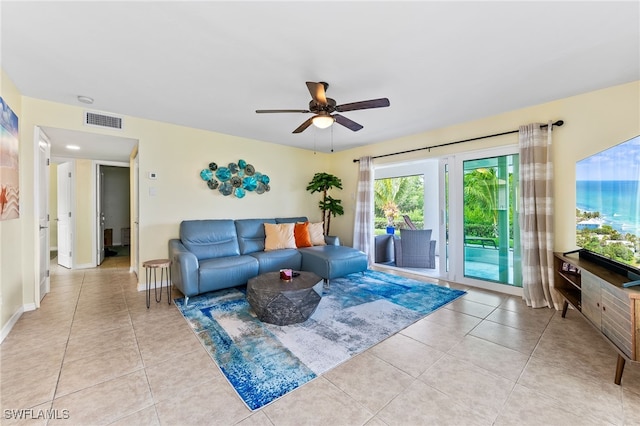 living room with ceiling fan and light tile patterned floors