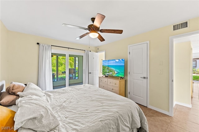 bedroom with ceiling fan, light tile patterned flooring, and access to outside