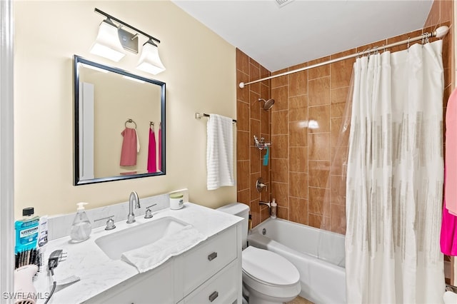 full bathroom featuring shower / bath combo with shower curtain, vanity, and toilet