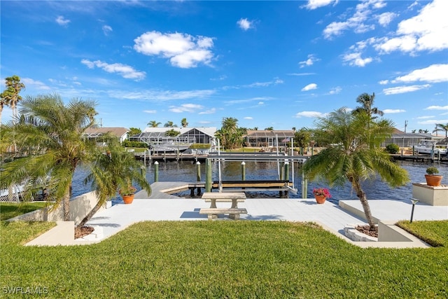 view of dock featuring a yard and a water view