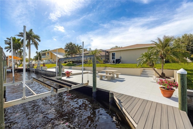 dock area with a water view