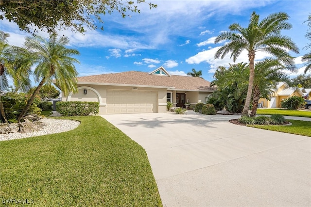 ranch-style house featuring a front yard and a garage