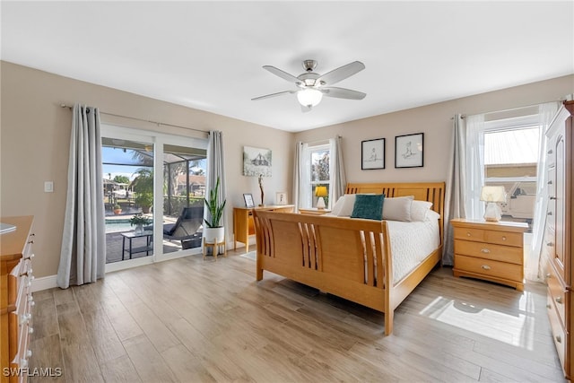 bedroom with access to exterior, light hardwood / wood-style flooring, and ceiling fan