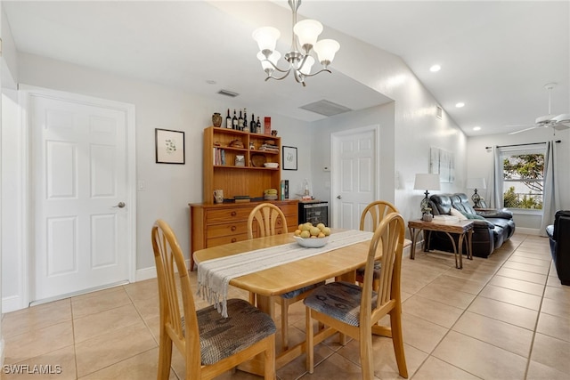 dining space featuring ceiling fan with notable chandelier and light tile patterned flooring