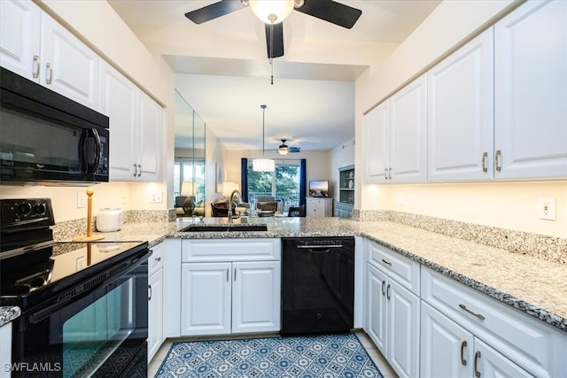 kitchen with black appliances, white cabinets, kitchen peninsula, and sink