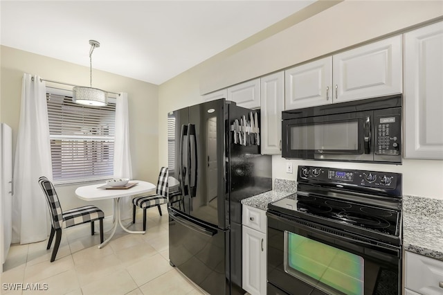 kitchen featuring light tile patterned floors, white cabinets, hanging light fixtures, light stone countertops, and black appliances