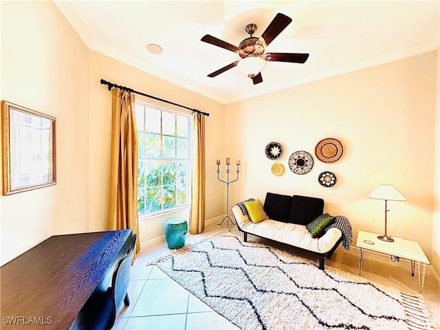 living area with ceiling fan and light tile patterned floors