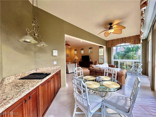 dining room with ceiling fan and light tile patterned floors