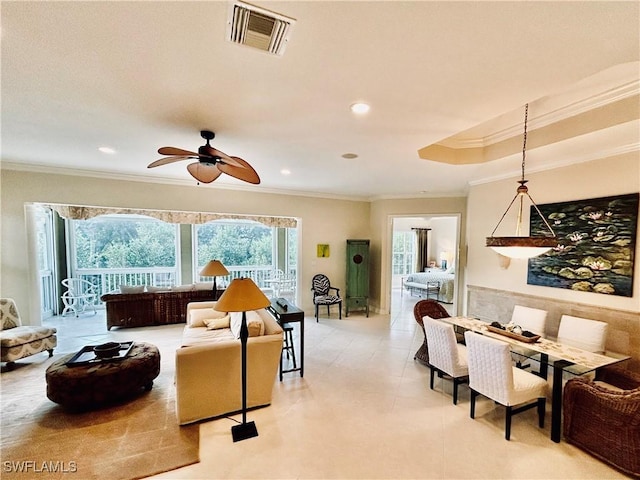 living room featuring crown molding and ceiling fan