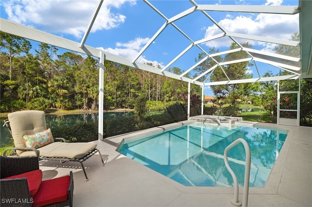 view of swimming pool with a patio area and a lanai