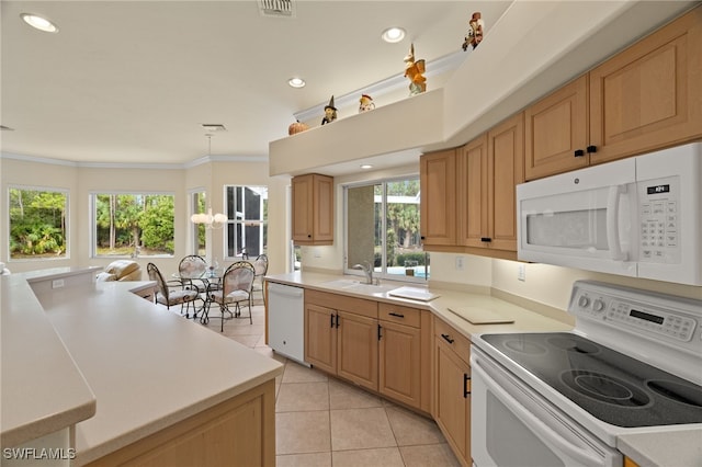 kitchen with white appliances, crown molding, sink, light tile patterned floors, and decorative light fixtures