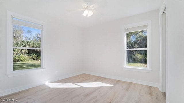 spare room with ceiling fan and light hardwood / wood-style flooring