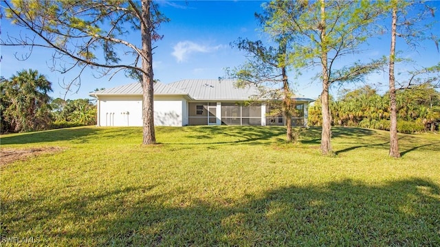 view of yard featuring a sunroom