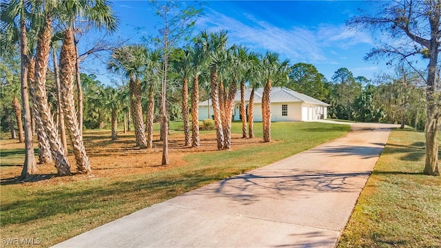 view of home's community featuring a lawn