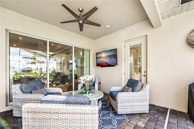 view of patio featuring outdoor lounge area and ceiling fan